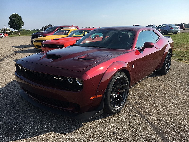 A wide-body Dodge Challenger SRT Hellcat sits with other Hellcat and SRT high-performance cars at the GingerMan Raceway in South Haven, Mich., for track safety school on Aug. 2, 2017. (Robert Duffer/Chicago Tribune/TNS)