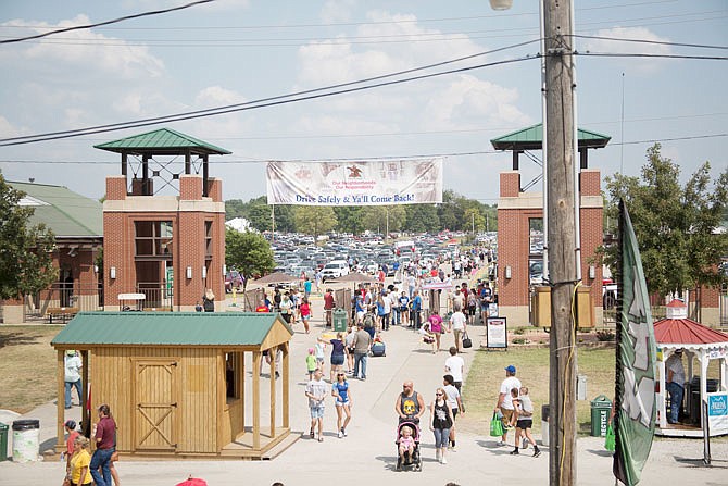 File: People flock through one of the gates to the 2018 Missouri State Fair. 