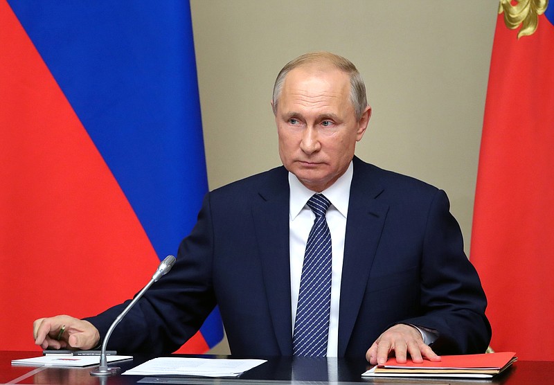 Russian President Vladimir Putin chairs a Security Council meeting in the Kremlin in Moscow, Russia, Monday, Aug. 5, 2019. Putin said that Russia will only deploy new intermediate-range missiles if the U.S. does, following the demise of a key nuclear pact, and called for urgent arms control talks to prevent a chaotic arms race. (Mikhail Klimentyev, Sputnik, Kremlin Pool Photo via AP)