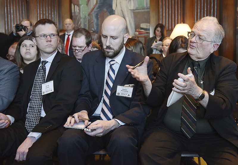 Bob Watson, at right, asks a question of Gov. Eric Greitens during a news conference in his Capitol office. March 2, 2017, was Associated Press Day at the Capitol during which members of the Missouri Press Association attended the afternoon question and answer session in the Governor's Office. Seated next to Watson are Jason Hancock, of the Kansas City Star, and Scott Lauck, of Missouri Lawyers Media.