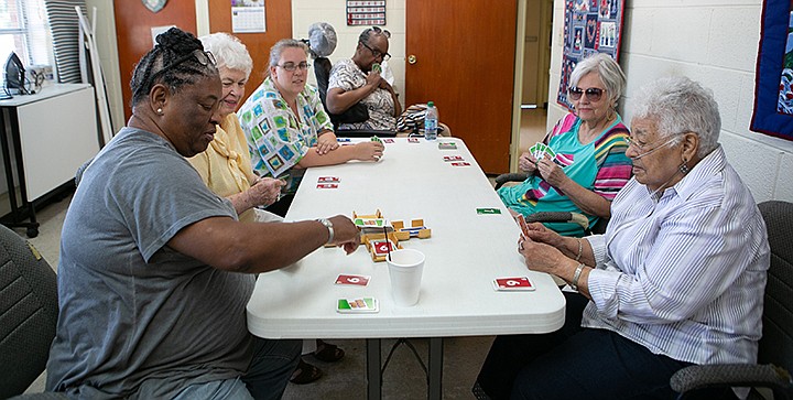 Ladies at the Collins Senior Center play a game of Skip-Bo on Thursday, July 11, 2019, in Texarkana, Texas. Seniors enjoy playing to game for the companionship and dealing with injuries they've acquired. Staff photo by Hunt Mercier 