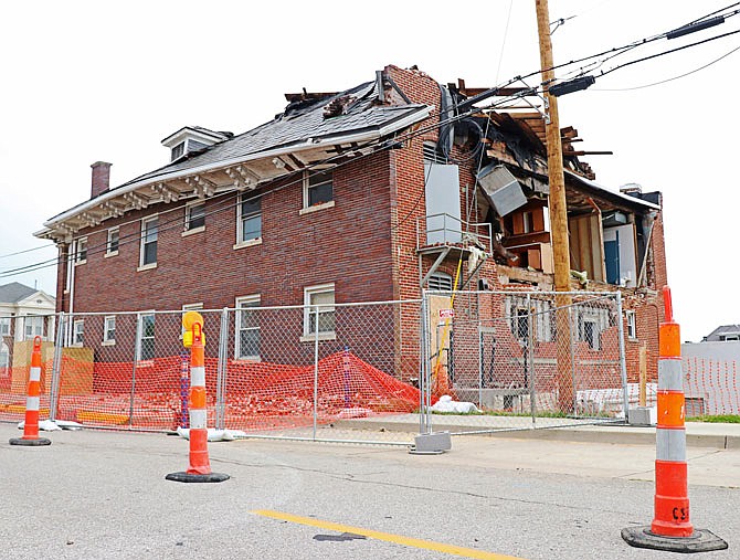 Seen from Lafayette Street, the roof of Avenue HQ at 621 E. Capital Ave. remains damaged due to rain exposure Wednesday. Avenue HQ co-owner Holly Stitt said the three buildings at 619, 621 and 623 E. Capital Ave. will be demolished.