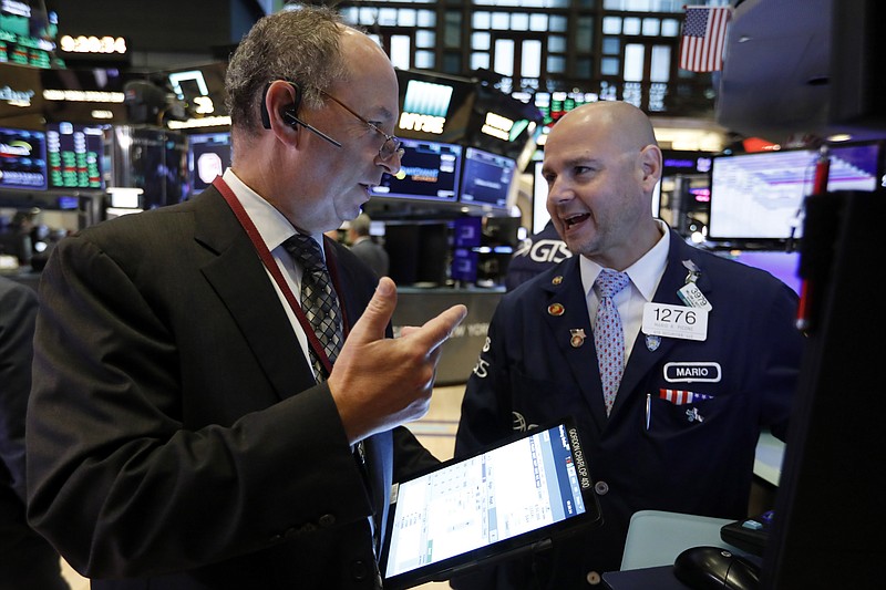 Trader Gordon Charlop, left, and specialist Mario Picone work on the floor of the New York Stock Exchange, Thursday, Aug. 8, 2019. Stock prices rose Thursday as investors braced for the next development in the U.S.-Chinese trade war, which has caused volatility in world markets this week, and after Beijing reported a rise in exports, easing some concerns about its economic slowdown. (AP Photo/Richard Drew)