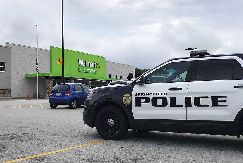 Springfield police respond to a Walmart in Springfield, Mo., Thursday afternoon, Aug. 8, 2019, after reports of a man with a weapon in the store. Police in Springfield, Missouri, say they have arrested an armed man who showed up the Walmart store wearing body armor, sending panicked shoppers fleeing the store.