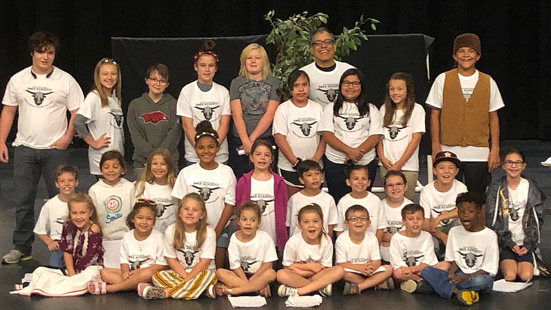 Cast members of the 2019 STAR Academy theater workshop play "Trouble Blooms at Ruby Ridge Ranch" gather for a photo before the presentation.