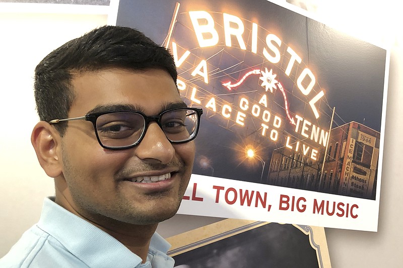 In this June 26, 2019 photo, Ashish Bibireddy, 23, poses for a photo at the Birthplace of Country Music Museum in Bristol, Va. Ten medical students were on a tour of the city organized by a medical school with the aim of luring them to practice in rural communities facing health care shortages after graduation. (AP Photo/Sudhin Thanawala)