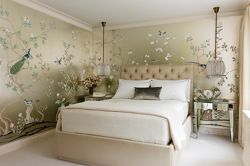 This undated photo provided by Craig & Company shows a master bedroom that interior designer Joan Craig designed for a New York client. Craig used a hand-painted Chinoiserie gilded silk from de Gournay. "Wallpaper is having its day," says Craig. "We can't get enough of it and neither can our clients." Antoine Bootz/Craig & Company via AP)