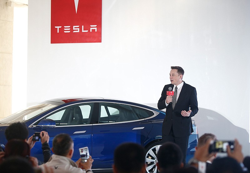 Elon Musk, Chairman, CEO and Product Architect of Tesla Motors, addresses a press conference to declare that the Tesla Motors releases v7.0 System in China on a limited basis for its Model S, which will enable self-driving features such as Autosteer for a select group of beta testers on October 23, 2015 in Beijing, China. The v7.0 system includes Autosteer, a new Autopilot feature. While it's not absolutely self-driving and the driver still need to hold the steering wheel and be mindful of road conditions and surrounding traffic when using Autosteer. When set to the new Autosteer mode, graphics on the driver's display will show the path the Model S is following, post the current speed limit and indicate if a car is in front of the Tesla.  (VCG via Getty Images/TNS)