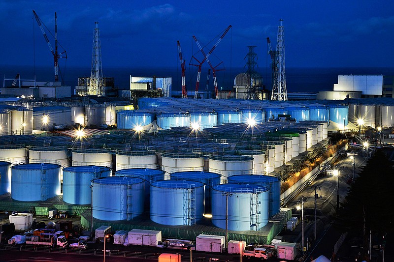 This Jan. 25, 2019, photo shows water tanks containing contaminated water that has been treated at the Fukushima Dai-ichi nuclear plant in Okuma town, Fukushima prefecture, northeastern Japan. The utility company operating Fukushima's tsunami-wrecked nuclear power plant said Friday, Aug. 9, 2019 it will run out of space for tanks to store massive amounts of treated but still contaminated water in three years, adding pressure for the government and the public to reach consensus on what to do with the water. (Kyodo News via AP)