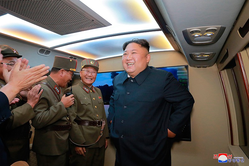 In this Tuesday, Aug. 6, 2019, photo provided by the North Korean government, North Korean leader Kim Jong Un, right, visits an airfield in the western area of North Korea to watch its weapons demonstrations. North Korea continued to ramp up its weapons demonstrations by firing two presumed short-range ballistic missiles into the sea Tuesday while lashing out at the United States and South Korea for continuing military exercises that the North says could derail fragile nuclear diplomacy. Independent journalists were not given access to cover the event depicted in this image distributed by the North Korean government. The content of this image is as provided and cannot be independently verified. Korean language watermark on image as provided by source reads: "KCNA" which is the abbreviation for Korean Central News Agency. (Korean Central News Agency/Korea News Service via AP)