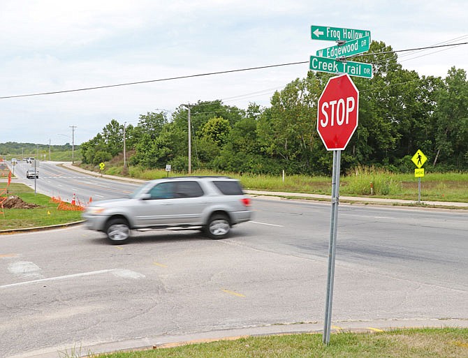 A car turns left onto Creek Trail Drive from West Edgewood Drive. The Jefferson City Public Works and Planning Committee and City Council are considering the construction of a roundabout at the intersection due to the anticipated increased traffic from the new high school. 