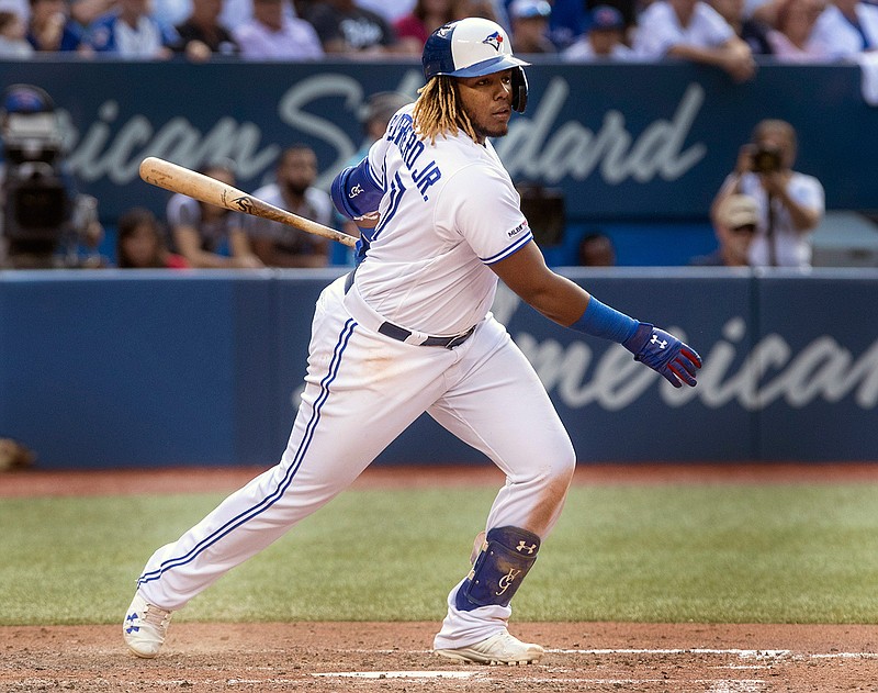 Toronto Blue Jays' Vladimir Guerrero Jr. hits a triple to score two runs during the seventh inning of a baseball game against the New York Yankees, Saturday, Aug. 10, 2019 in Toronto. (Fred Thornhill/The Canadian Press)