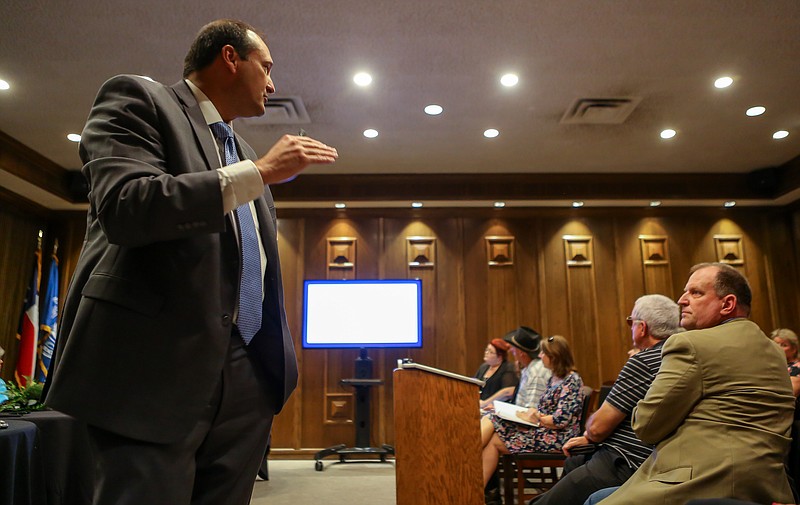 Texarkana College's president, Dr. Jason Smith, gives a presentation of why the college is deciding to do a half of a cent increase in tuition at a public hearing on Monday, August 12, 2019, in Texarkana, Texas. The hearing was open to the public to comment on the proposed tax increase to the county for the college to improve it's facilities for students. (Staff photo by Hunt Mercier)