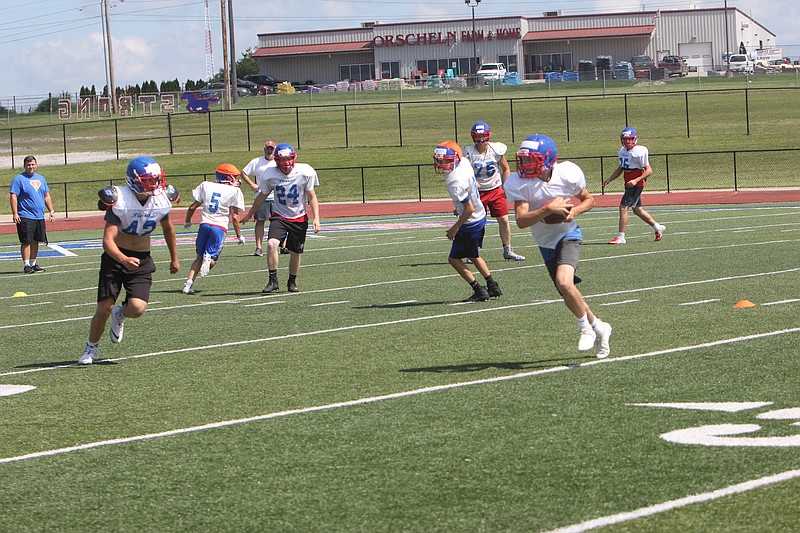 The California Pintos football team drills at their 2019 summer camp.