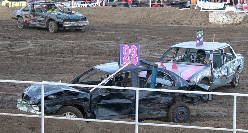 Physics and motivation help push a car into the side track Aug. 10, 2019, at the Moniteau County Fair Demolition Derby.