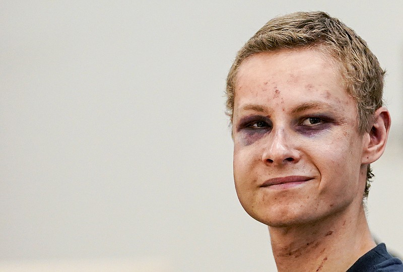 Suspected gunman Philip Manshaus appears in court, in Oslo, Norway, Monday, Aug. 12, 2019. A suspected gunman accused of an attempted terrorist attack on an Oslo mosque and separately killing his teenage stepsister "will use his right not to explain himself for now" in a detention hearing, his defense lawyer said Monday. (Cornelius Poppen, NTB scanpix via AP)