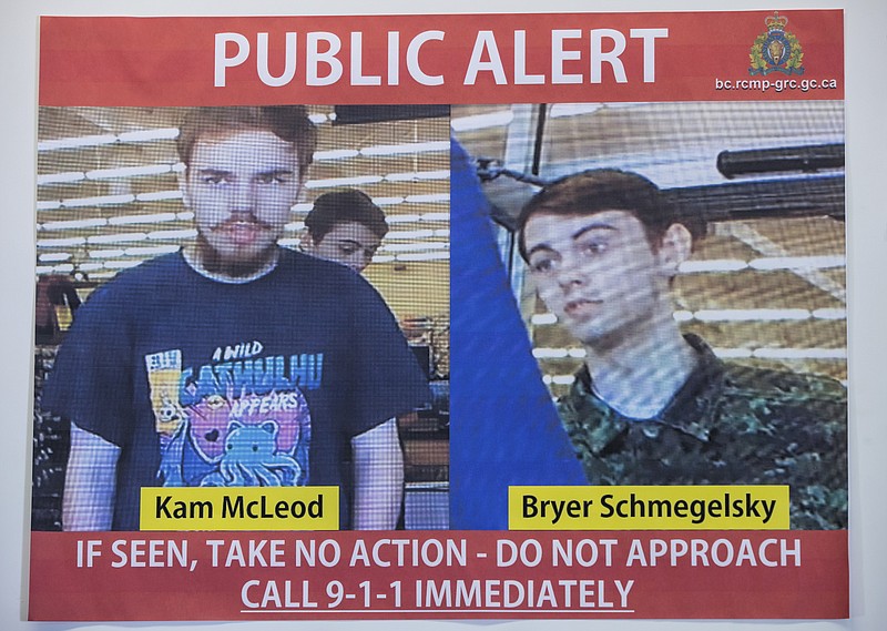 In this July 23, 2019 file photo, security camera images of fugitives Kam McLeod, 19, and Bryer Schmegelsky, 18, are displayed during a news conference in Surrey, British Columbia.  Police said Wednesday, Aug. 7, 2019, they believe the two fugitives suspected of killing a North Carolina woman and her Australian boyfriend as well as another man have been found dead in Manitoba. (Darryl Dyck/The Canadian Press via AP File)