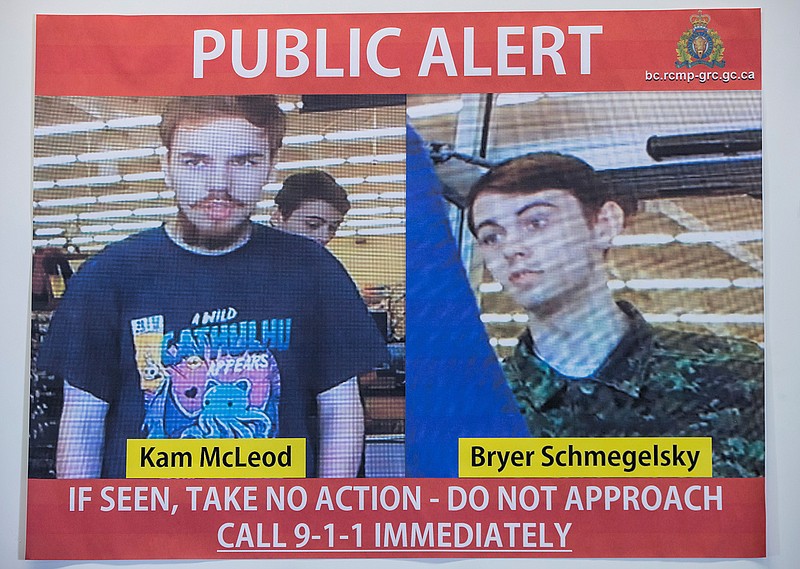 In this July 23, 2019 file photo, security camera images of fugitives Kam McLeod, 19, and Bryer Schmegelsky, 18, are displayed during a news conference in Surrey, British Columbia.  Police said Wednesday, Aug. 7, 2019, they believe the two fugitives suspected of killing a North Carolina woman and her Australian boyfriend as well as another man have been found dead in Manitoba. (Darryl Dyck/The Canadian Press via AP File)