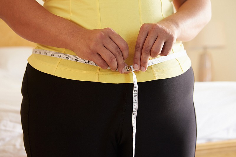 A new report found that women with a waist circumfrance of 35 inches or more had an increased risk for health issues. (Dreamstime/TNS) 