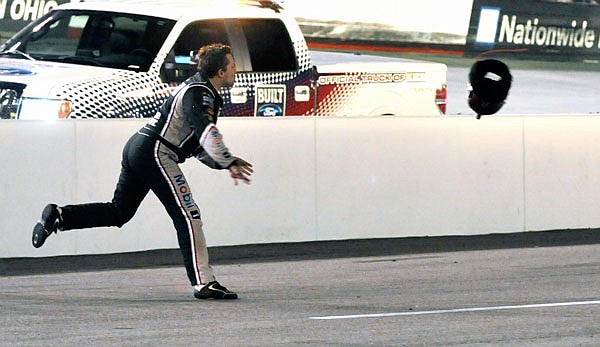 In this Aug. 25, 2012, file photo, Tony Stewart throws his helmet at Matt Kenseth's car after the two collided during a NASCAR Sprint Cup Series race at Bristol Motor Speedway in Bristol, Tenn.