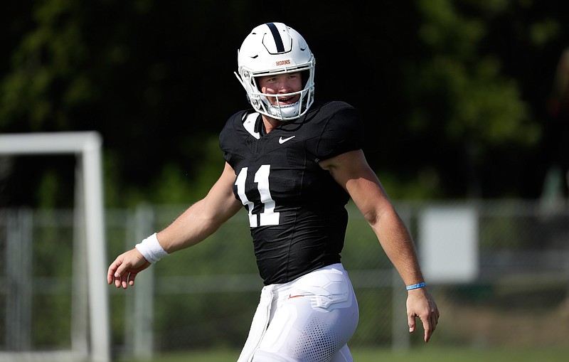 Texas quarterback Sam Ehlinger takes part in a morning practice at the team's facility in Austin, Texas, Wednesday, Aug. 7, 2019. (AP Photo/Eric Gay)