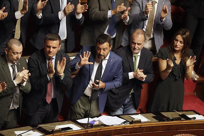 Italian Interior Minister and Deputy-Premier Matteo Salvini is applauded by The League party's lawmakers as he addresses the Senate in Rome, Tuesday, Aug. 13, 2019. Italy’s political leaders scrambled to line up allies and form alliances Tuesday as the country’s right-wing interior minister pressed his demands for an early election in the hope of snagging the premiership as a platform for his anti-migrant, euroskeptic agenda. Senators hastily summoned back from a vacation break convened for a vote on scheduling their consideration of a no-confidence motion lodged by Matteo Salvini’s League party against Premier Giuseppe Conte’s 14-month-old populist government. (AP Photo/Alberto Pellaschiar)