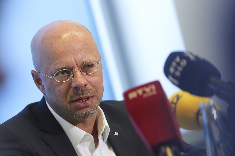 Andreas Kalbitz the Alternative for Germany, AfD, top candidate for the regional election in the German state of Brandenburg attends a news conference in Berlin, Germany, Tuesday, Aug. 13, 2019. On Sunday Sept.1, 2019 regional state elections will take place in the eastern German state of Brandenburg. (AP Photo/Markus Schreiber)