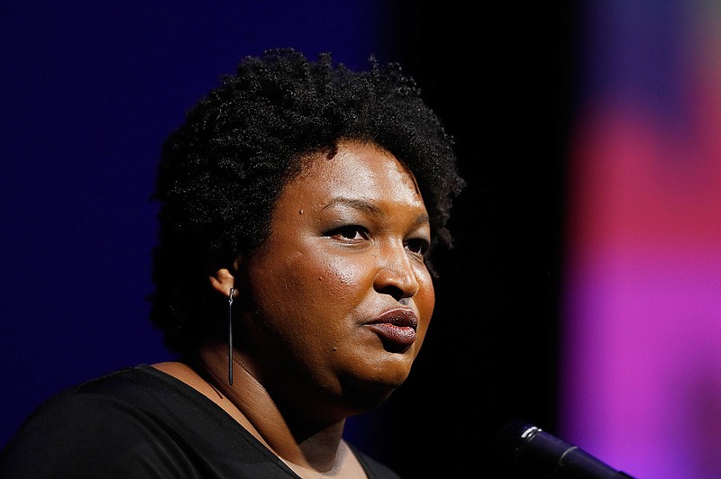 This July 22, 2019, file photo shows former Georgia House Minority Leader Stacey Abrams addressing the 110th NAACP National Convention,  in Detroit. Abrams is set to announce a multimillion-dollar initiative to staff and fund voter protection teams in battleground states across the country ahead of the 2020 elections. An aide familiar with the decision said she'll focus on the new program rather than run for president herself. The aide said Abrams would announce the initiative Tuesday, Aug. 13, 2019, during a speech before a labor union convention in Las Vegas.
(AP Photo/Carlos Osorio, File)