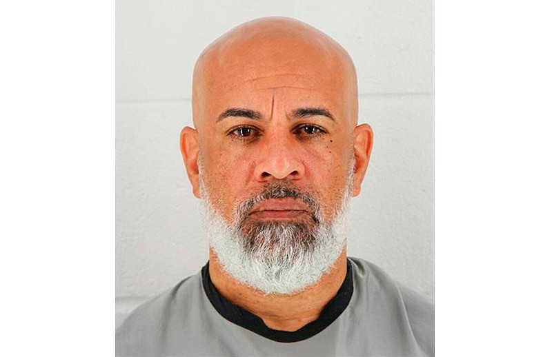 In this photo provided by the Johnson County, Kansas Sheriff's Office, Charles Pearson is pictured in a booking photo dated Oct. 8, 2018. Kansas City, Kansas, police have identified Pearson as the man they fatally shot near a popular shopping area after he said he had killed his wife. (Johnson County, Kansas Sheriff's Office via AP)