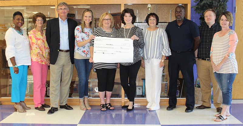 Board members of the Margaret Daniel Education Foundation presented grants to Ashdown educators during their Back to School Breakfast on Aug. 6. Grants were provided to purchase a Cricut maker, a T-shirt press, Playa Way Library, Dash and Dot iPad minis and Grammar Planet for a total of $10,235.57. The foundation sponsors a dinner and silent auction each year to raise money to support "out of the box" innovative ideas from Ashdown teachers. Shown, from left, are board members Brenda Tate, Katrina Williamson, Thad Bishop, Mallory Wharton, Beth Provence, Teachers Ryan Murry, Gail Wade, Elmorris Hopkins, Matthew Glasgow and Kari Harger. (Submitted photo)
