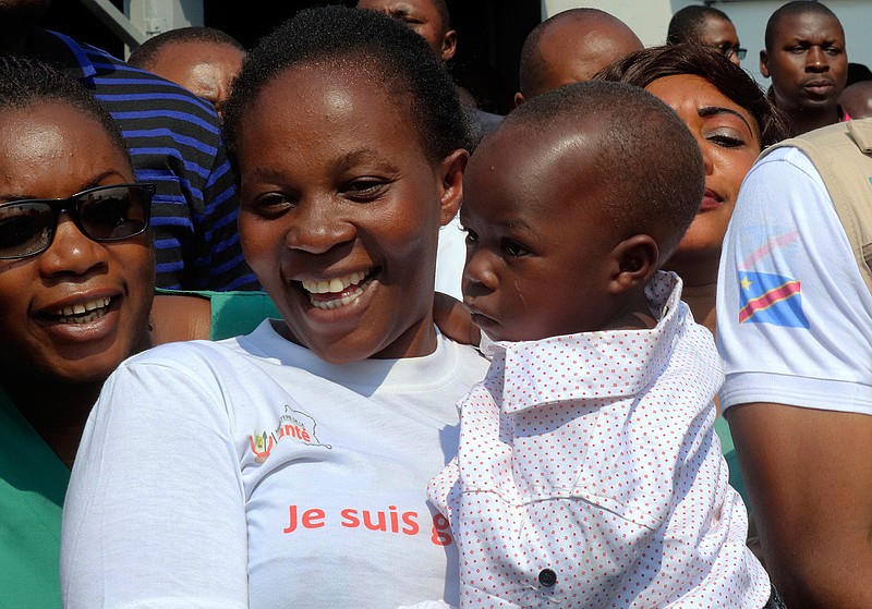 Esperance Nabintu and her one-year-old son, Ebenezer Fataki, after the two had been declared cured of Ebola, in Goma, Congo Tuesday, Aug. 13, 2019. The two were treated with new anti-Ebola drugs by top doctors who said that the disease can be cured if people seek proper care. (AP Photo/Justin Katumwa)