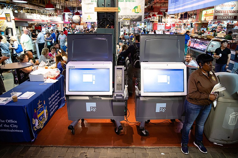 In this June 13, 2019, file photo, ExpressVote XL voting machines are displayed during a demonstration at the Reading Terminal Market in Philadelphia. More than one in ten voters could vote on paperless voting machines in the 2020 general election, according to a new analysis, leaving their ballots vulnerable to hacking according to a new study. (AP Photo/Matt Rourke, File)