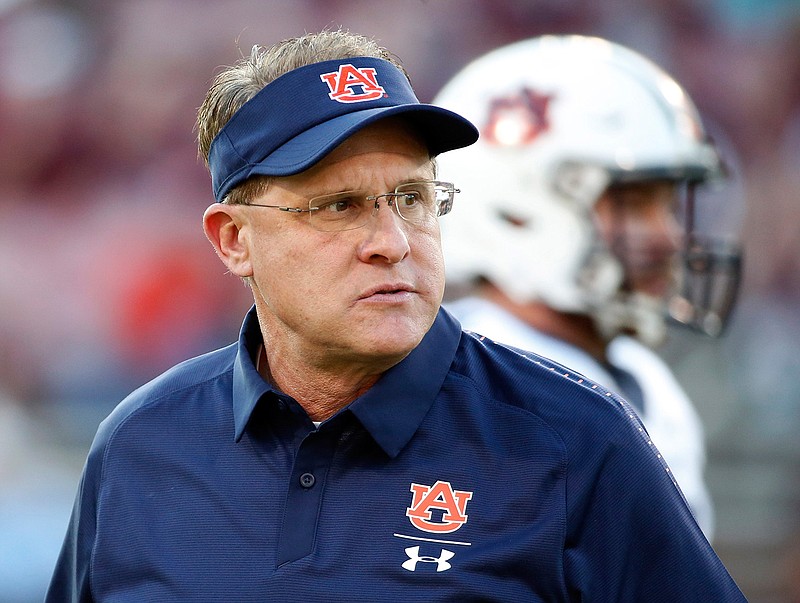  In this Oct. 6, 2018, file photo, Auburn coach Gus Malzahn watches players warm up before an NCAA college football game against Mississippi State in Starkville, Miss. The Tigers have been one of the most difficult teams in the country to predict in recent years. Fittingly, the same can be said of Malzahn's long-term job security. (AP Photo/Rogelio V. Solis, File)