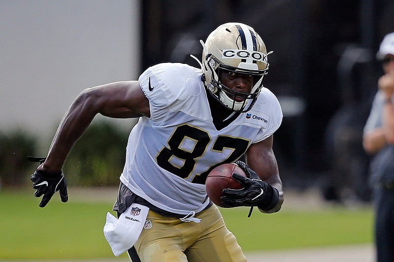 In this July 29, 2019, file photo, New Orleans Saints tight end Jared Cook (87) runs through drills during training camp at their NFL football training facility in Metairie, La. After a decade in the NFL that often fell short of expectations _ particularly in Green Bay with star QB Aaron Rodgers in 2016 _ Cook has decided that the degree to which he succeeds begins with his own determination to master the scheme in which he plays and his effort to cultivate a strong rapport with his quarterback. (AP Photo/Gerald Herbert, File)