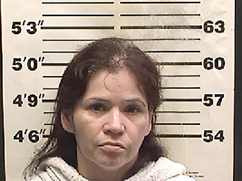 This undated booking photo provided by the Navarro County, Texas, sheriff's office is of 42-year-old Juana Marquez, who was charged following the scalding death of a young girl in Corsicana, south of Dallas. Police in Corsicana said in a statement Monday that the girl, believed to be 4 years old, suffered burns to much of her body when she pulled a pot of boiling water from a stove Saturday. Authorities say Marquez, who was at the home tried to treat the child herself and didn't call for an ambulance. (Navarro County Sheriff's Office via AP)