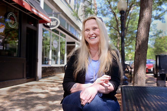 Author Christine McDonald sits in downtown Jefferson City on Wednesday after speaking about her experiences with at-risk youth. McDonald will be one of three speakers at HALO's INSPIRE women's conference Sept. 14.