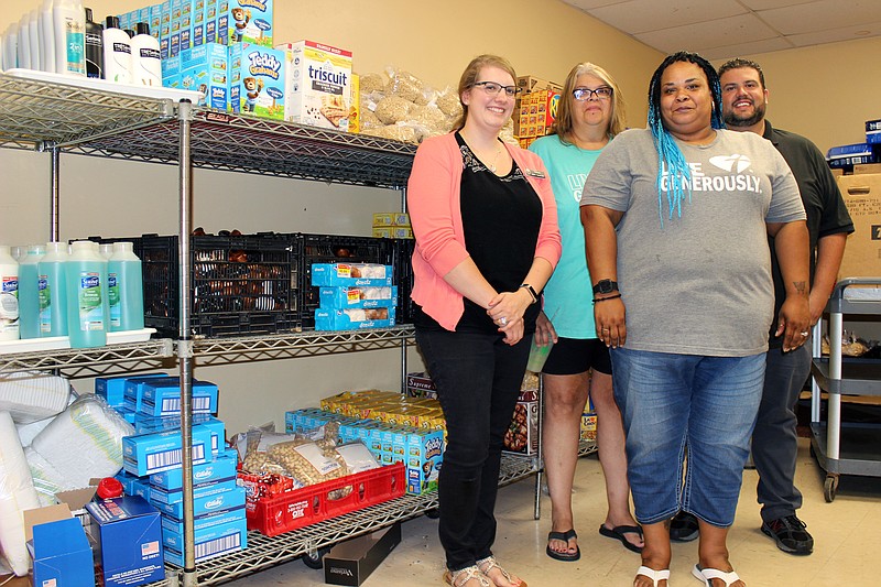 <p>Rebecca Martin/News Tribune</p><p>Pictured from left are secretary Shannon Dawson, cook Debbie Kuhr, social service case manager Nikki Eddings and Center of Hope shelter Director Brian Vogeler of The Salvation Army Jefferson City.</p>