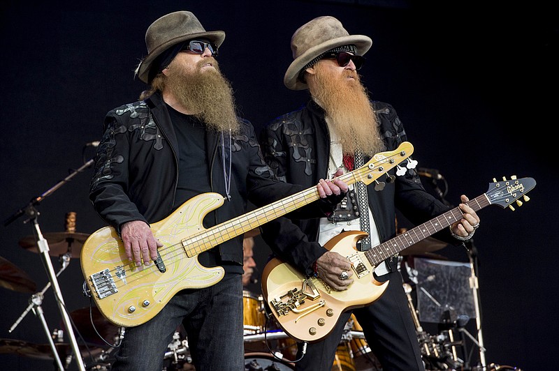  In this June 24, 2016, file photo, Dusty Hill, left, and Billy Gibbons from the rock band ZZ Top perform at the Glastonbury music festival at Worthy Farm, in Somerset, England. Joe Walsh will be joined by ZZ Top, Brad Paisley, Sheryl Crow, and Jason Isbell and The 400 Unit at his VetsAid music festival to benefit veterans. The award-winning musician announced Monday, Aug. 12, 2019, file photo, that tickets for the Nov. 10 concert at the Toyota Center in Houston will go on sale Friday. (Photo by Jonathan Short/Invision/AP, File)