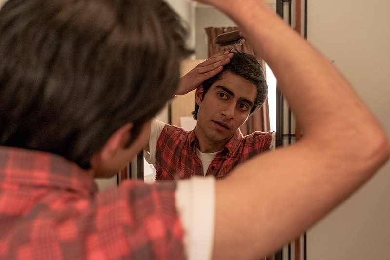 This image provided by Warner Bros. Entertainment Inc. shows Viveik Kalra in a scene from "Blinded by the Light," a Warner Bros. Pictures release in which Kalra plays Javed, a Pakistani-British teen whose life is transformed when a friend introduces him to Bruce Springsteen's music in 1987 Britain. (Nick Wall/Warner Bros. Entertainment Inc. via AP)