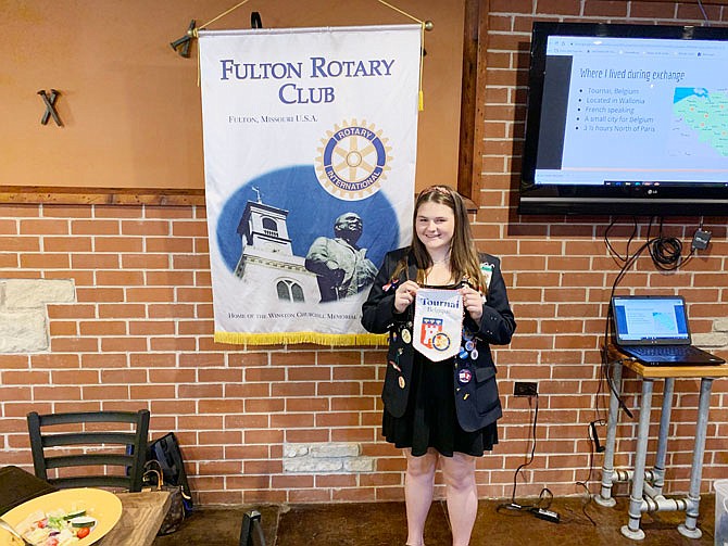 Fulton High School senior Hope Gowin holds her gift from the Rotary Club in Tournai, Belgium, that she presented to the Fulton Rotary Club. Gowin spent 11 months living in Belgium as a part of the Rotary Youth Exchange program.