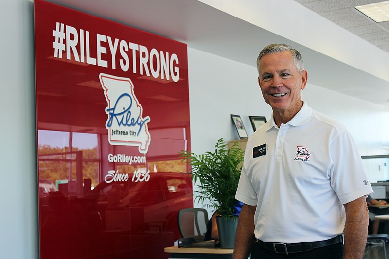 <p>Rebecca Martin/News Tribune</p><p>Kevin Riley, who owns Riley Toyota and Riley Chevrolet Buick GMC with brothers Carey Riley and Mike Riley, stands inside the Chevrolet dealership’s temporary sales location at 3205 Missouri Blvd.</p>