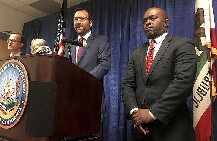 Democratic state Sen. Ben Allen of Santa Monica, center, speaks beside Superintendent Tony Thurmond, right, at a news conference Wednesday Aug. 14, 2019, in Sacramento, Calif. California's public education chief is seeking changes to what would be the nation's first statewide ethnic studies curriculum. State Superintendent Tony Thurmond said Wednesday that he will recommend amendments to better reflect the contributions of Jewish Americans while removing portions that the California Legislative Jewish Caucus found objectionable. (AP Photo/Don Thompson)
