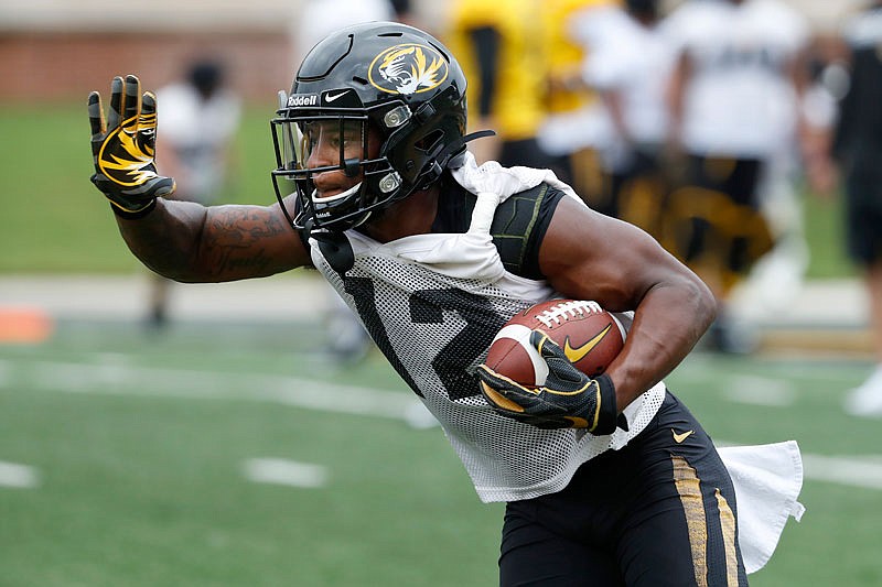 Missouri wide receiver Johnathon Johnson runs with the ball during practice Monday on Faurot Field.