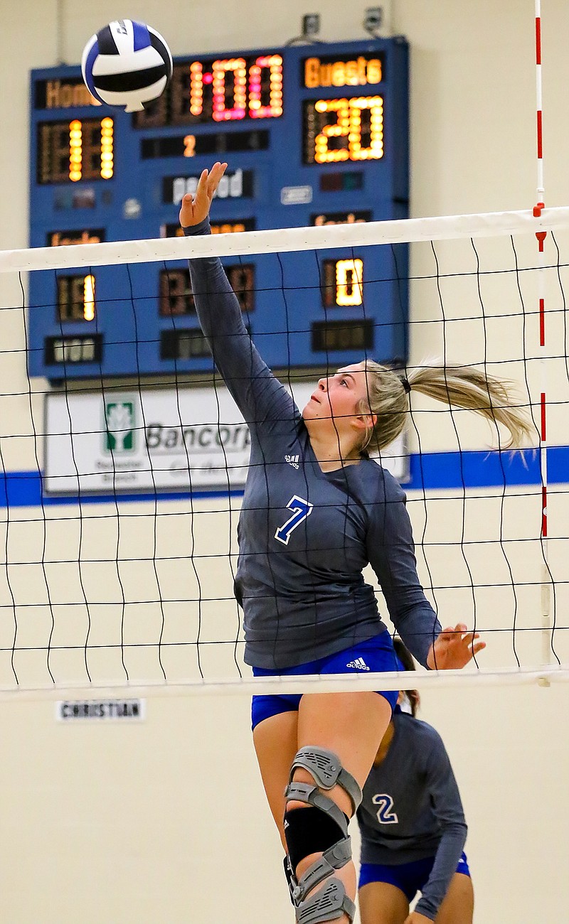 Paul Pewitt's Jo Osmon jumps up to tip the ball back against Columbia Christian School at the Spikers' Classic on Thursday at Redwater High School in Redwater, Texas.