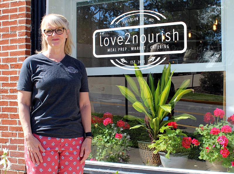 <p>Rebecca Martin/News Tribune</p><p>Laurel Dunwoody stands outside her East High Street business, Love2Nourish. Dunwoody and Love2Nourish provided about 8,200 meals to tornado victims and disaster relief volunteers over the two weeks following the May 22 tornado.</p>
