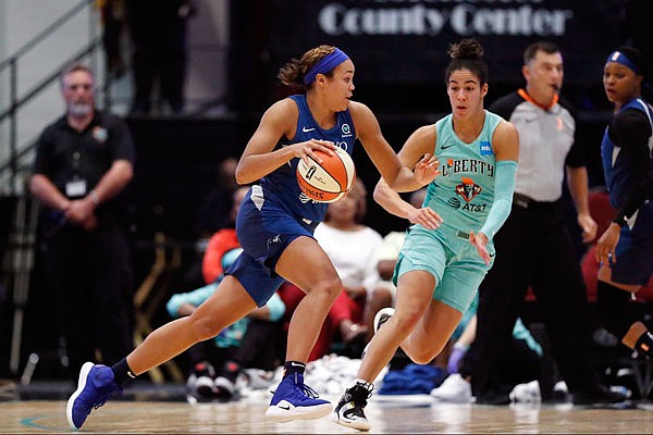 Napheesa Collier of the Lynx drives toward the basket as Kia Nurse of the Liberty defends during a game last Tuesday in White Plains, N.Y.