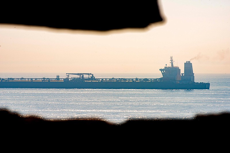 A view of the Grace 1 supertanker stands off the coast of the British territory of Gibraltar, Friday Aug. 16, 2019.  The lawyer representing the captain of the Iranian supertanker caught in a diplomatic standoff said Friday that the captain no longer wants to be in command of the ship, which is in need of repairs that could prevent its immediate departure from Gibraltar. (AP Photo/Marcos Moreno)