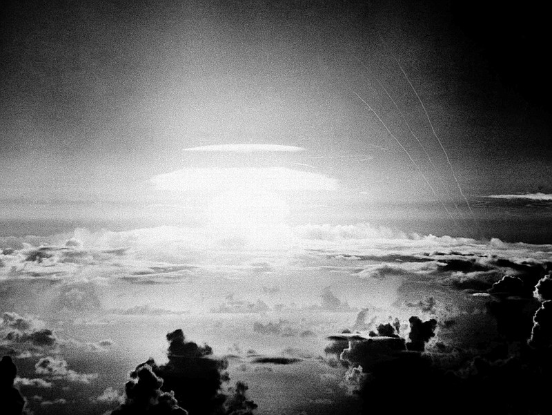 FILE - In this May 21, 1956, file photo, the fireball of a hydrogen bomb lights the Pacific sky a few seconds after the bomb was released over Bikini Atoll. A Texas-based company is facing criticism for naming a beer after the location of nuclear tests that resulted in the contamination of a Pacific island chain, a report said. Manhattan Project Beer Company is under scrutiny by Marshall Islanders who were exposed to high levels of radiation by U.S. government research from 1946 to 1958, The Pacific Daily News reported Thursday, Aug. 15, 2019. (AP Photo, File)