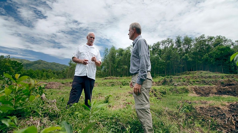 In an image provided by ESPN from video, Rocky Bleier talks with ESPN reporter Tim Rinaldi in Hiep Duc Valley, about 35 miles (56 kilometers) south of Danang in Vietnam, on Aug. 20, 2018. Three months into his deployment to Vietnam, Bleier was shot through the thigh and suffered a grenade blast to his foot. Doctors told him that he'd never play football again. Steelers owner Art Rooney supported Bleier by placing him on injured reserve rather than cutting him from the team. Bleier then defied the odds, returning to football as a star running back on the "Steel Curtain" Steelers teams of the 1970s and becoming the only war veteran to have four Super Bowl rings. (ESPN via AP)