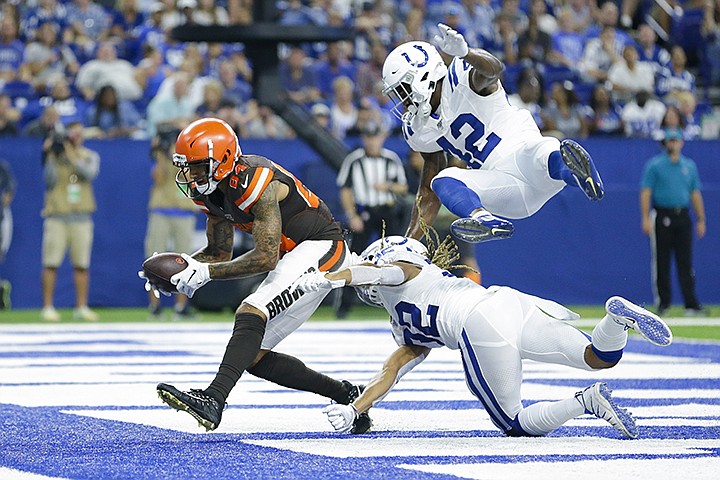 Cleveland Browns wide receiver Derrick Willies (84) makes a catch for a touchdown in front of Indianapolis Colts cornerback Jalen Collins (32) and defensive back Rolan Milligan (42) during the second half of an NFL preseason football game in Indianapolis, Saturday, Aug. 17, 2019. (AP Photo/AJ Mast)
